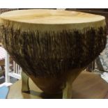 An African Style Animal Skin Drum, 51cm high, 57cm diameter