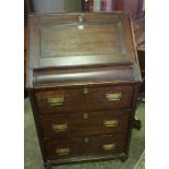 A Stained Wood Writing Bureau, Having a fall front, enclosing fitted pigeon holes, above three