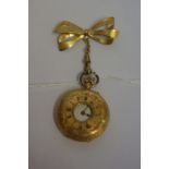 A 18ct Gold Half Hunter Ladies Fob Watch, stamped 18k, lacking glass to front, also with a rolled