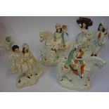 Four Victorian Staffordshire Flatback Figures, one example modelled as a married couple, 30cm