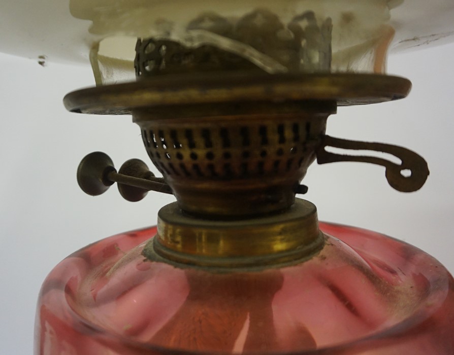 A Vintage Brass Corinthian Style Oil Lamp, Having a cranberry glass reservoir, with shade, 40cm - Image 2 of 4