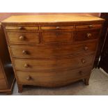 A Georgian Mahogany Bow Front Chest of Drawers. Having three shallow drawers above three small