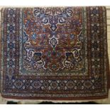A Fine Isfahan Rug, Decorated with allover multi coloured geometric and floral motifs, on a brown