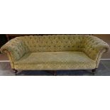A Chesterfield Three Seater Sofa, Upholstered in yellow fabric, decorated with allover green