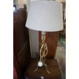 A Gilded Wrought Iron Table Lamp, 57cm high, fitted for electricity, with shade