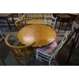 An Antique Style Mahogany Coffee Table, Having a circular top, 59cm high, 99cm wide, also with a