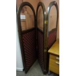 A Stained Wood Three Section Dressing Screen, Having an arch shaped top, above a glass panel and