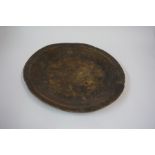 An Antique Oak Dish, 43cm diameter