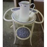 A Vintage Enamel Toilet Jug with Bowl, Raised on a fitted painted two tier stand, overall