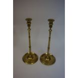 A Pair of Brass Candlesticks, circa 19th century, of tall form, raised on a knopped stem and