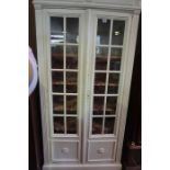 An Antique French Painted Bibliotheque (Display) Cabinet, Having two glazed doors, enclosing a