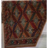 An Azmilk Rug, Decorated with allover multi coloured geometric motifs, on a brown ground, 110cm x