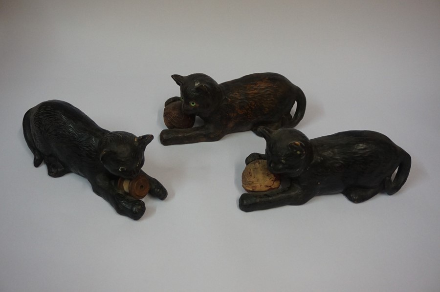 Three Similar Bretby Terracotta Cat figures, each figure having glass eyes and holding a ball, - Image 2 of 3