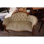 A Victorian Walnut Framed Ladies Sofa, upholstered in later pale green button back fabric,