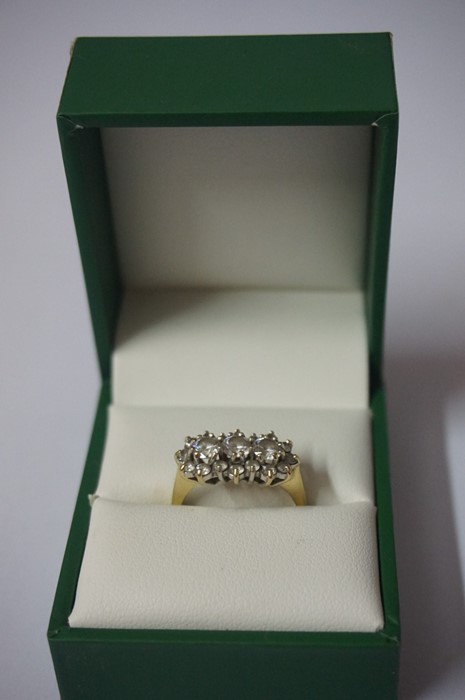A Ladies 14ct Gold and Diamond Three Stone Ring, the diamond content is approximately 1 carat,