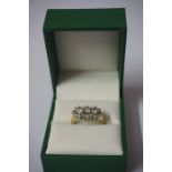 A Ladies 14ct Gold and Diamond Three Stone Ring, the diamond content is approximately 1 carat,