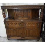 A Jacobean Style Oak Court Cupboard, circa 20th century, Having a cupboard door to the top,