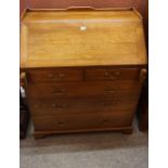 An Oak Writing Bureau, circa early 20th century, Having a three quarter gallery back, above a fall