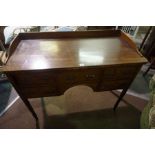 A Victorian Mahogany Kneehole Desk, Having a three quarter gallery to the top, above a central