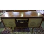 A Vintage Radiogram by Bush, 72cm high, 122cm wide, 40cm deep