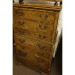 A Walnut Chest of Drawers, circa early to mid 20th century, Having seven drawers, 116cm high, 85cm