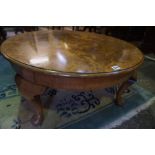 A Figured Walnut Circular Coffee Table, Having label to underside for John Taylor & Son Edinburgh,