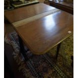 A Victorian Mahogany Sutherland Table, Having drop ends, terminating on ceramic castors, areas of