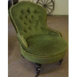 A Victorian Nursing Chair, Upholstered in a later green button back velour, raised on turned feet