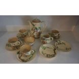 A Clarice Cliff "Tall Trees and Cottages" Pattern Coffee Set by Wilkinson, circa 1930s, Comprising