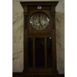 A Vintage Oak Wall Clock, Having a silvered dial, 64cm high