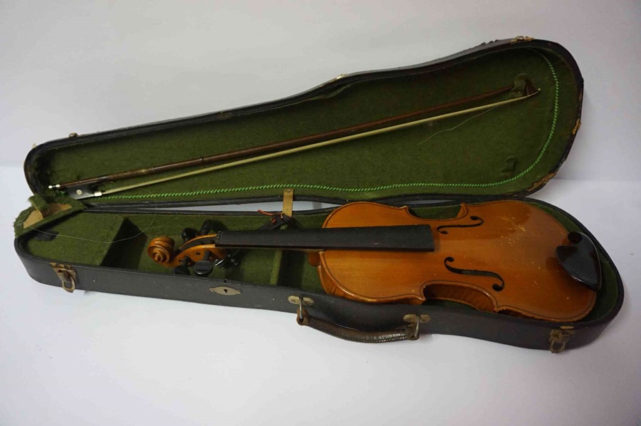 A Stradivarius Copy Violin, 59cm long, with a horse hair bow, in fitted case