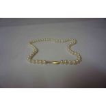 A String of Cultured Pearls, stamped 14k to clasp, 45cm long