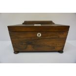 A Regency Rosewood Sarcophagus Tea Caddy, circa early 19th century, Enclosing a fitted interior
