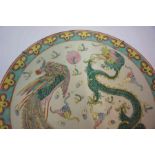 A Chinese Famille Rose Plate, circa late 19th century, Decorated with a polychrome four claw