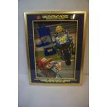 A Signed Glove by Valentino Rossi, Enclosed in a glazed display, 53cm x 39cm, framed