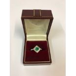A Fine 18ct White Gold Emerald and Diamond Ring, in the Art Deco style, having marquise cut diamonds