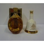 A Bottle of Haig Dimple De Luxe Scotch Whisky, 70 proof, 26 fl ozs, with box, also with a Bells