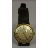 An Omega Gents 9ct Gold Geneve Wristwatch, circa 1950s, 60s, Having manual wind, baton markers,