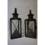 A Pair of Vintage Carriage Oil Lamps, Having glazed panels, stamped British made to wick, 47cm high,