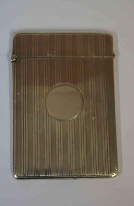 A Silver Card Case, Having a circular cartouche, with engine turned decoration, 10cm high, 2.025 oz,