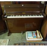 The Eavestaff Minipiano, cased in mahogany, 86cm high, 121cm wide, 45cm deep, with a quantity of