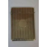 A Silver Card Case, Having a circular cartouche, with engine turned decoration, 10cm high, 2.025 oz,