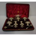 Silver Seven Piece Condiment Set, Hallmarks for London 1927-28, with four spoons, in fitted case,