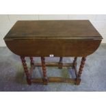 A Vintage Oak Drop Leaf Table, Raised on barley column legs, 68cm high, 77cm wide and long