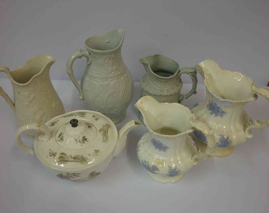 Three Victorian Relief Pottery Jugs, One example by Ridgway, also with two graduated jugs, and a tea