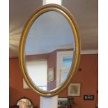 Gilt Oval Wall Mirror, also with an oak occasional table, (2)