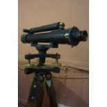 Surveyors Theodolite by Hutchison & Co Edinburgh, raised on a wooden tripod stand, also with