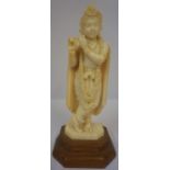 Indian Carved Ivory Figure, Pre 1947, Modelled as Krishna, raised on a wooden base
