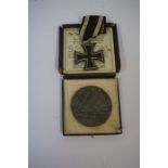 The Lusitania (German) Medal 1915, boxed, also with a 1914 German iron cross, with attached