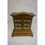Dutch Style Oak Cabinet, Having two glazed doors enclosing a shelved interior,
